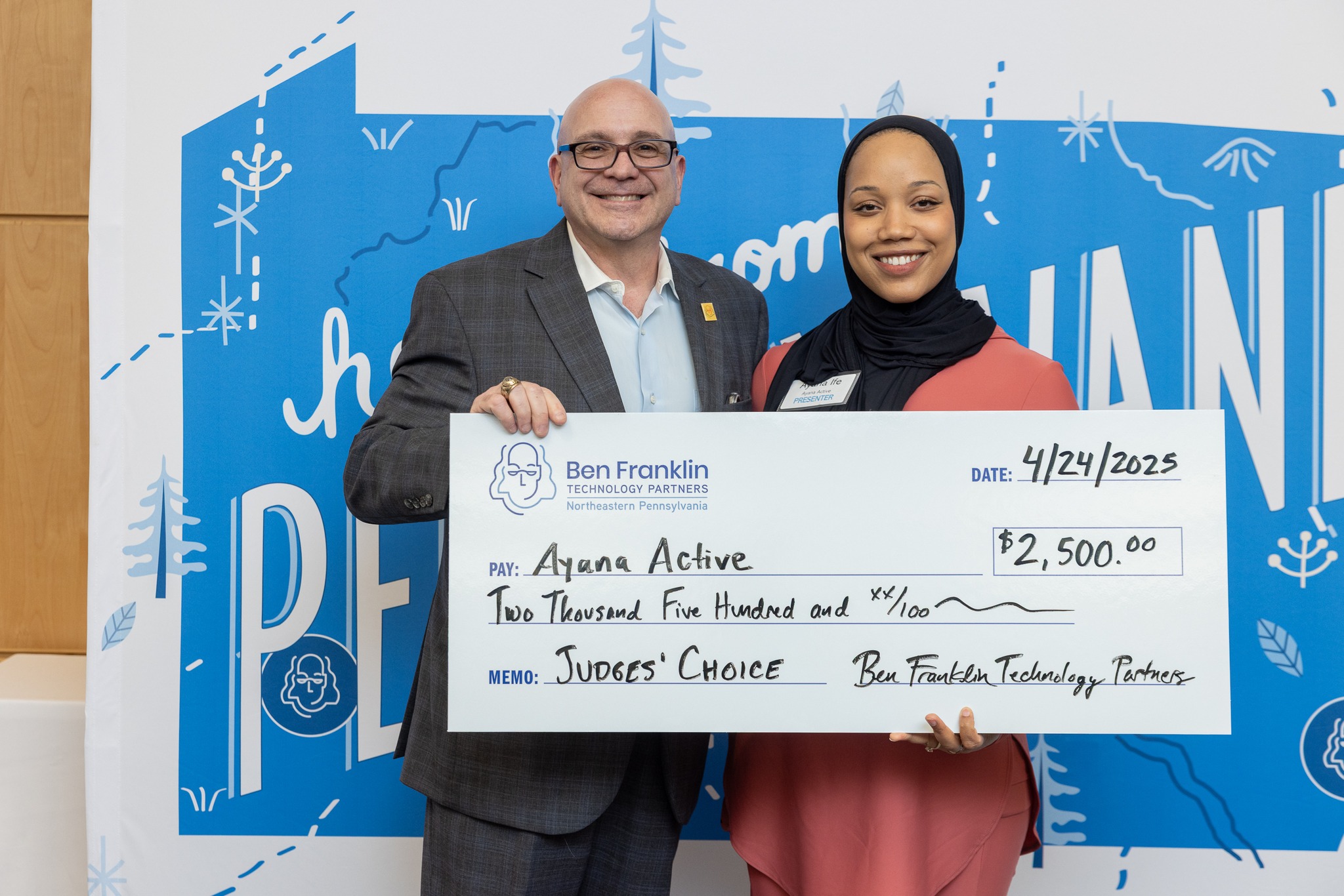 Ayana Ife receiving check